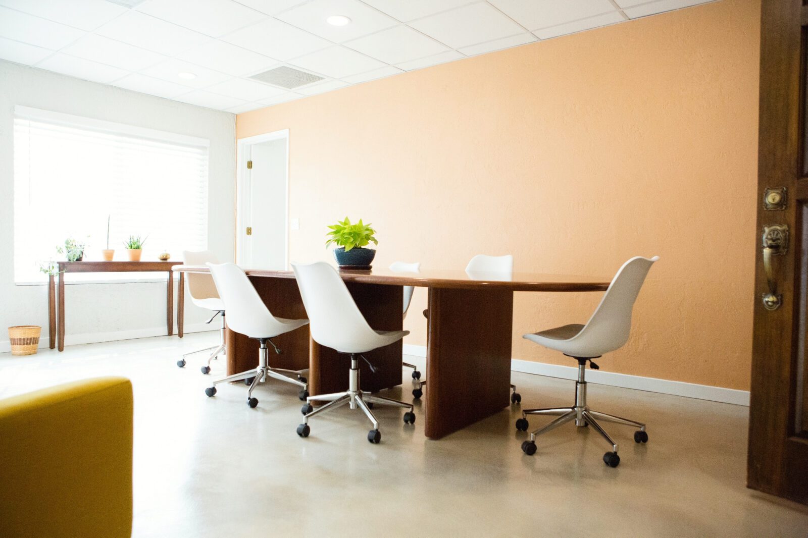 a large meeting table and chairs around it