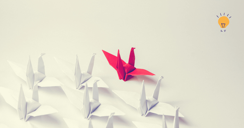 a red  and white paper origami birds